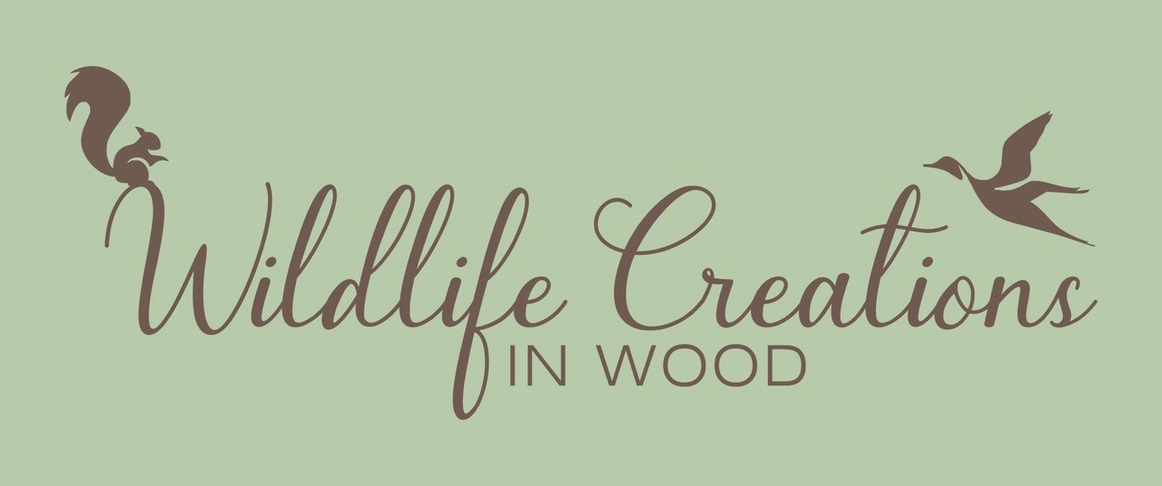 Wildlife creations in wood logo